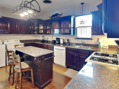 a kitchen with blue cabinets and a counter top at Hidden Haven in Galveston