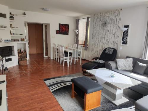 a living room with a couch and a table at Na Kopci 84 in Staré Křečany