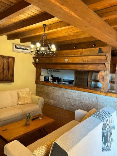 a living room with a couch and a table at El LABRAO DE ALARDOS in El Raso