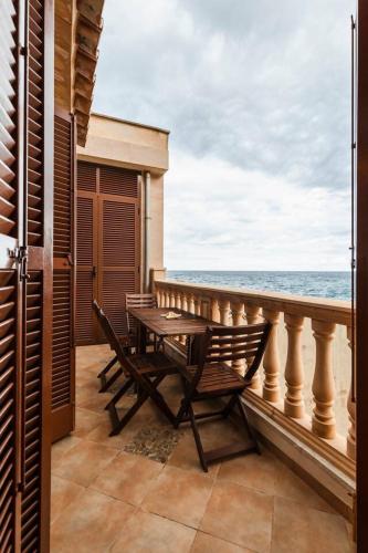 a balcony with a table and chairs and the ocean at Casa Villa Mar - Port de Valldemossa in Valldemossa
