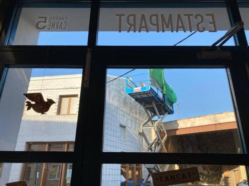 a window in a store with a view of a building at Casa taller Penelles in Penellas