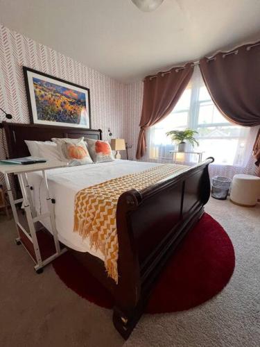 a bedroom with a large bed and a window at Banquet Hotels Tacoma-Lakewood-Puyallup-DuPont-Lacey-Olympia in DuPont