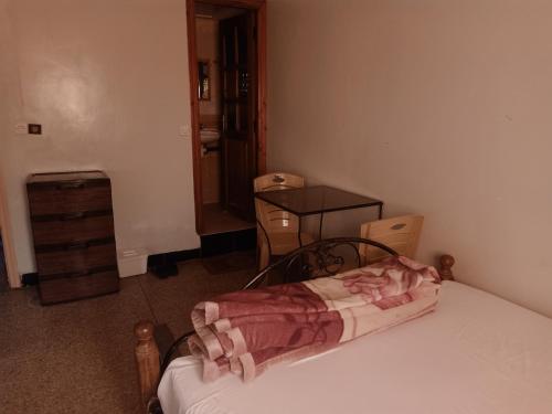 Postel nebo postele na pokoji v ubytování hôtel hicham