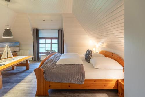 Postel nebo postele na pokoji v ubytování Neukoog Deichzeit