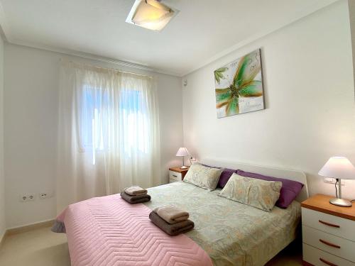 Postel nebo postele na pokoji v ubytování Encantador bungalow de planta baja