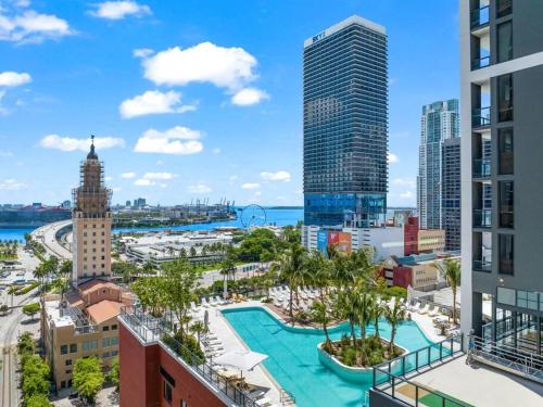 a view of a city with a pool and buildings at PH 5107 Gale Luxury 1BR with Sea - Downtown Views in Miami