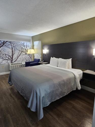 Ένα ή περισσότερα κρεβάτια σε δωμάτιο στο Quality Inn near Blue Spring