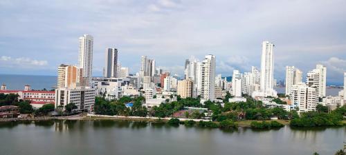 a city with tall buildings and a body of water at Mirador del Laguito 13003 in Cartagena de Indias