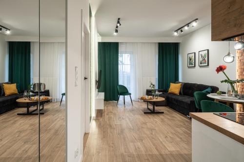a living room with a couch and a table at AboutArtApartments - By the river in Wrocław