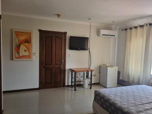 Postel nebo postele na pokoji v ubytování Hotel Condominio Casa Blanca