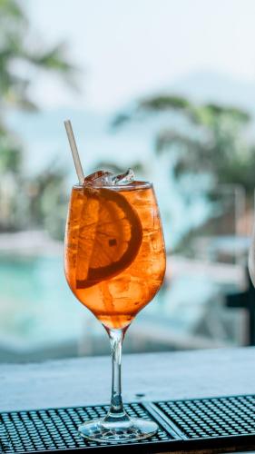 a drink in a glass sitting on a table at Catalina Hotel in Ubatuba