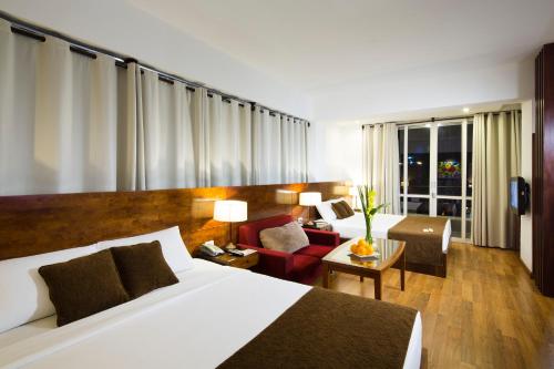 Starlet Hotel tesisinde bir odada yatak veya yataklar