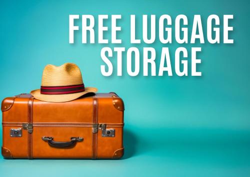 a hat is sitting on top of a suitcase at Il Magnifico Superior Rooms 400m from Tiburtina Railway Station and 290m from Metro in Rome