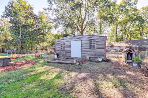 a tiny house in a yard with a backyard at 8 Mi to Jackson State University Peaceful Getaway in Jackson