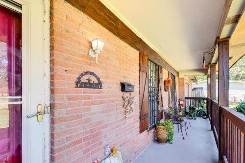 a building with a brick wall and a patio at 8 Mi to Jackson State University Peaceful Getaway in Jackson