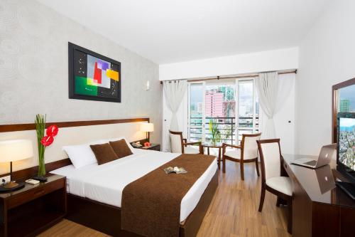 Postel nebo postele na pokoji v ubytování Starlet Hotel
