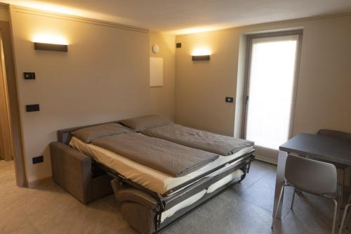 En eller flere senge i et værelse på Baita della Valle - Appartamento Stella Alpina