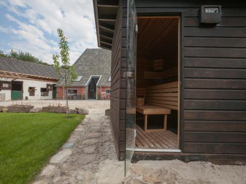 a wooden house with a bench inside of it at Norgerbrink in Norg
