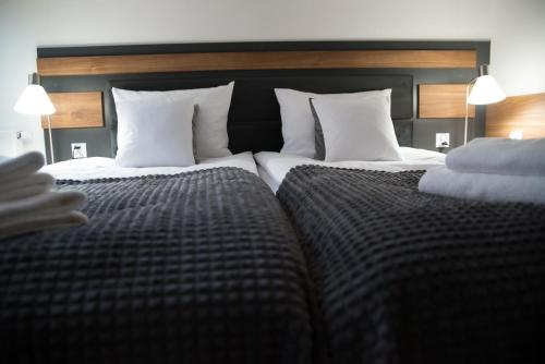 Postel nebo postele na pokoji v ubytování Hotel Sukcesor