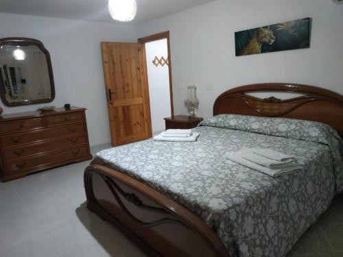 Ένα ή περισσότερα κρεβάτια σε δωμάτιο στο Al Castello Casa Vacanze