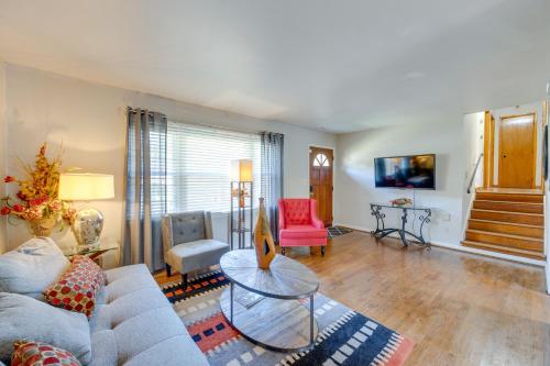 a living room with a couch and a table at 5 Mi to Trussville Birmingham Home with Balcony in Birmingham