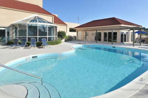 a large swimming pool in front of a building at TOPS'L Beach Manor I in Destin