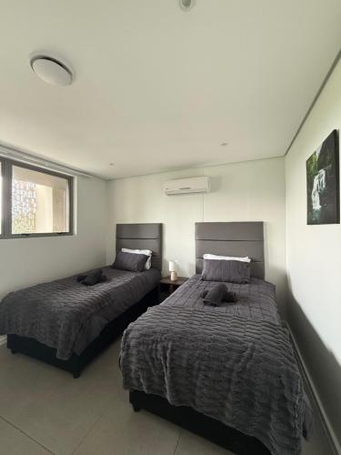 Postel nebo postele na pokoji v ubytování Pebble Haven Umhlanga