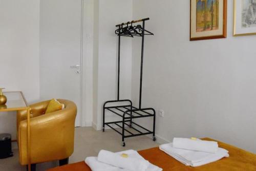 a living room with a couch and a chair at Bright Urban Cukor Suite - Balcony - Free Parking - Near Arena & Jarun in Zagreb