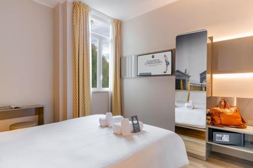 Ein Bett oder Betten in einem Zimmer der Unterkunft B&B Hotel Roma Pietralata Tiburtina