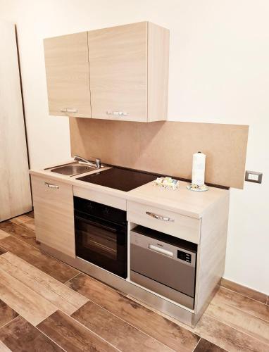 a kitchen with a sink and a stove at La Collina in Deruta
