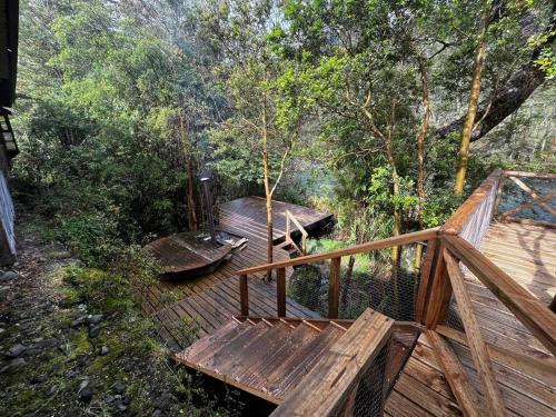 an overhead view of a wooden deck in the woods at Casa en Río Puelo, Cochamo in Puelo