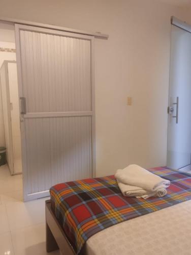 Un ou plusieurs lits dans un hébergement de l'établissement Sandalio Hostal Cali