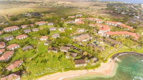 an aerial view of a resort next to the beach at New remodeled Kiahuna Paradise condo in Koloa