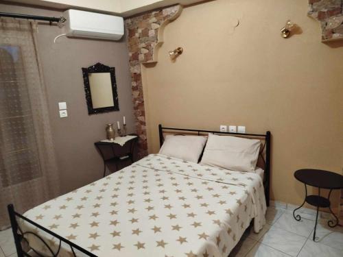 a bedroom with a large bed with stars on it at Kostis Hause in Kastrákion