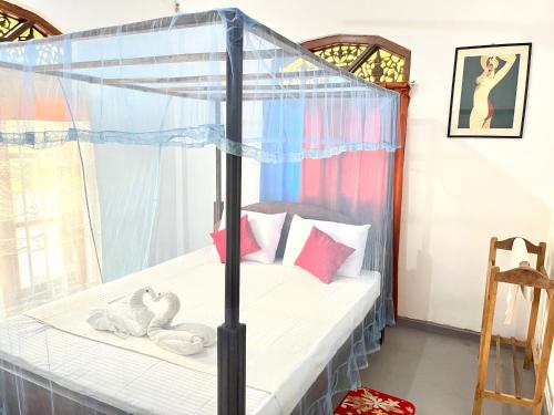 Postel nebo postele na pokoji v ubytování Malsha Villa