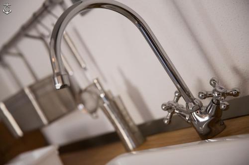 a bathroom sink with a silver faucet at Central Apartment in Dubrovnik