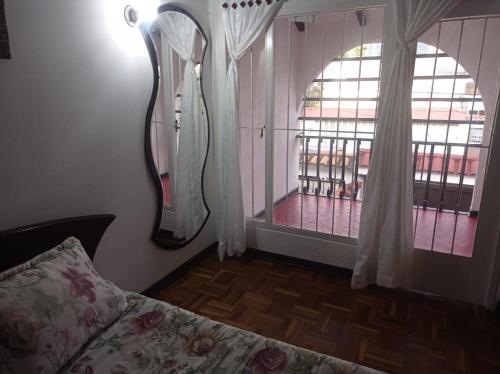 Postel nebo postele na pokoji v ubytování Hotel chimenea calle 100