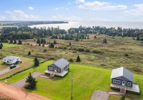 an aerial view of two houses on a grassy field at The Perfect Getaway in Bedeque