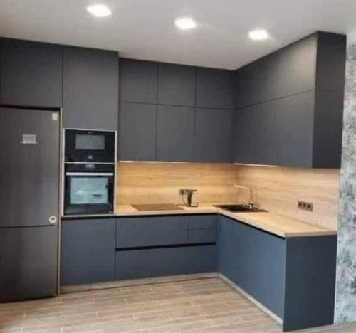 Кухня или мини-кухня в B living Apartments
