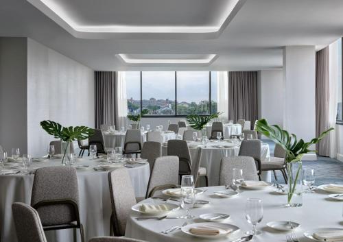 a conference room with white tables and chairs at InterContinental San Antonio Riverwalk by IHG in San Antonio