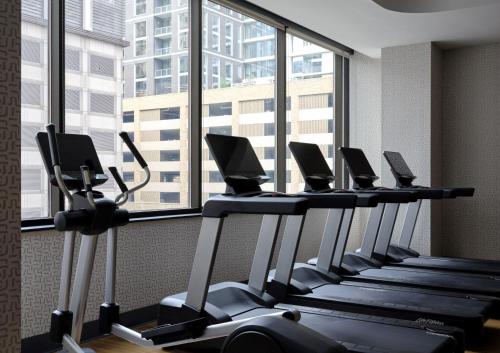 a row of treadmills in a gym with a large window at InterContinental San Antonio Riverwalk by IHG in San Antonio