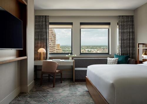 a hotel room with a bed and a desk at InterContinental San Antonio Riverwalk by IHG in San Antonio