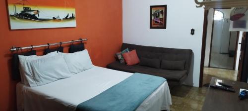 Rúm í herbergi á Arraial do Cabo - Suite luxo