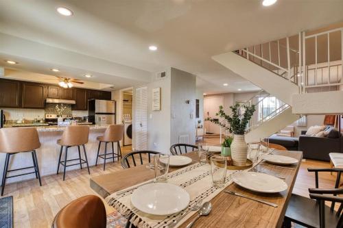 a kitchen and living room with a table and chairs at The Scott Casa - Walkable to Old Town Scottsdale, vibrant space, inviting patio! in Scottsdale