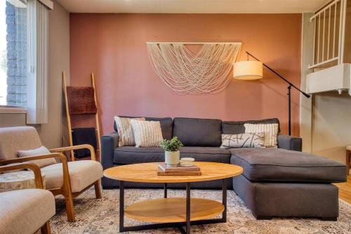 a living room with a couch and a table at The Scott Casa - Walkable to Old Town Scottsdale, vibrant space, inviting patio! in Scottsdale