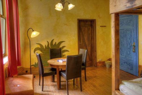 a dining room with a table and chairs at Gästehaus Mezcalero in Dresden