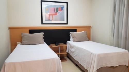 Ένα ή περισσότερα κρεβάτια σε δωμάτιο στο Bienal Suites Flat