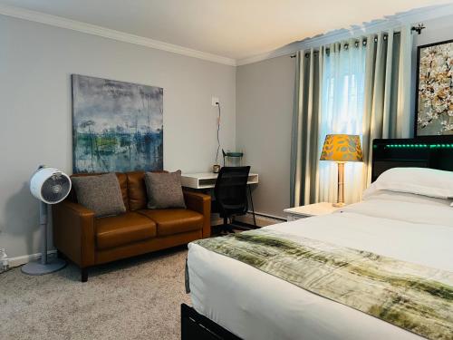 a bedroom with a bed and a chair and a desk at Sherizee Home in Marblehead