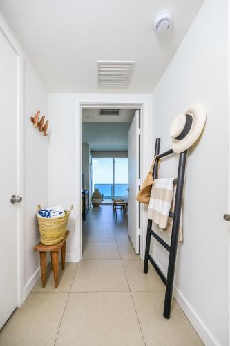 a hallway with a view of the ocean from a house at MonteCarlo Miami Beach in Miami Beach