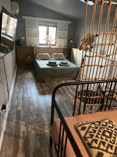 a bedroom with a bed in a room at Marvellous Attic Studio in the Old Town in Bucharest